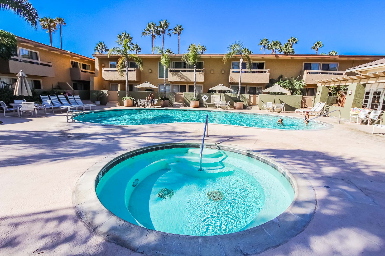 A view of the outdoor swimming pool and Jacuzzi at VRI's Winner Circle Resort in California.